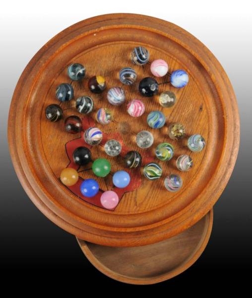 SOLITAIRE MARBLE BOARD WITH 32 HANDMADE MARBLES.  