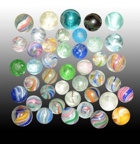 LOT OF 42: ASSORTED HANDMADE MARBLES.             