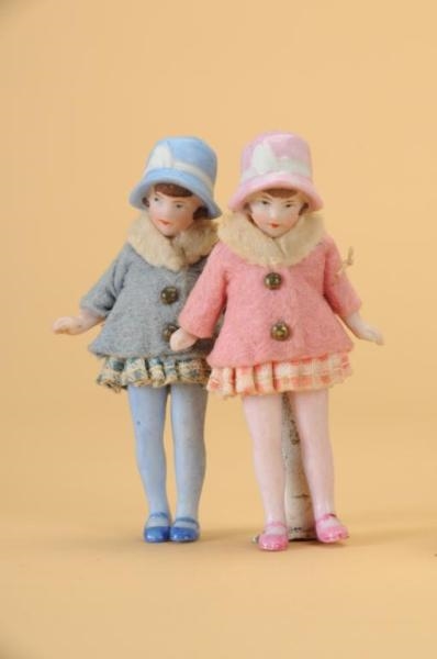 PAIR OF HERTWIG DOLLS WITH MOLDED BONNETS         