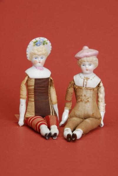 TWO HERTWIG DOLLS WITH MOLDED BONNETS             