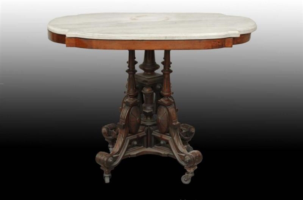 WALNUT MARBLE TOP OVAL VICTORIAN TABLE.           