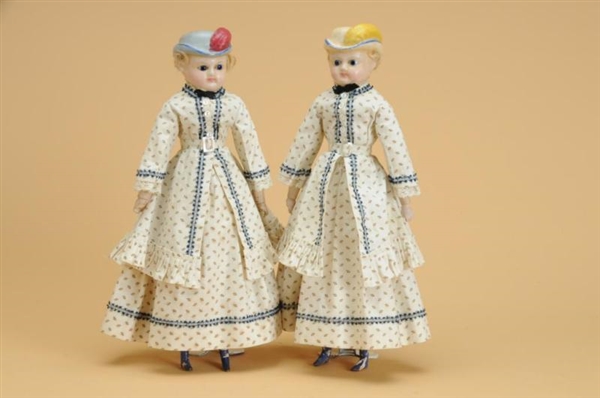 WAX  SISTER DOLLS WITH MOLDED BONNETS             