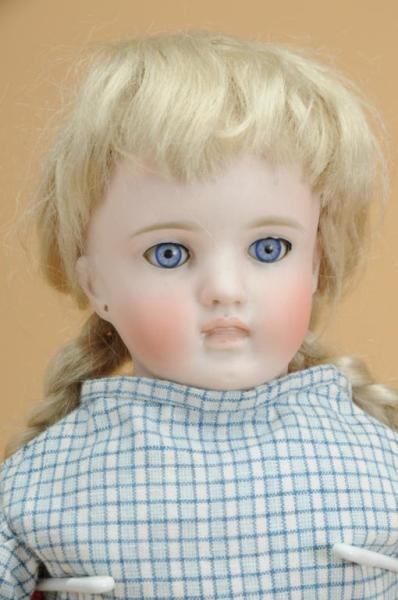 CHILD DOLL WITH CLOSED MOUTH                      