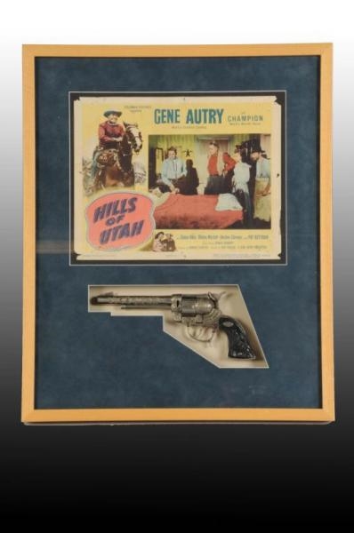 GENE AUTRY LOBBY CARD & TOY CAP GUN.              
