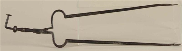 WROUGHT IRON PIPE TONGS WITH TAMPER.              
