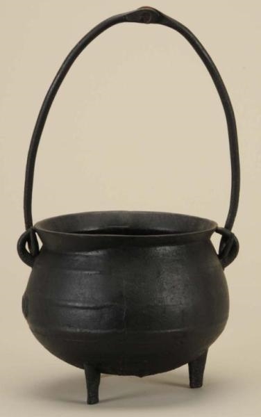AMERICAN THREE-LEGGED CAST POT WITH ROUNDED EARS. 