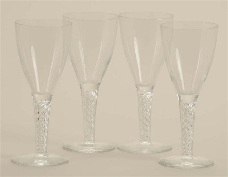 LOT OF 4: COLORLESS GLASS AIR TWIST WINES.        