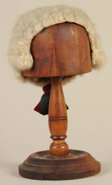 TURNED WOODEN HAT STAND.                          