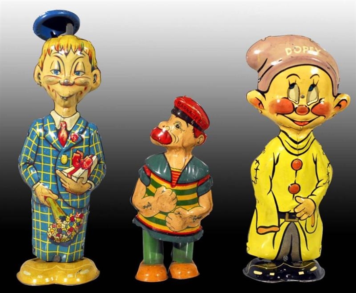 LOT OF 3: TIN COMIC WIND-UP TOYS.                 