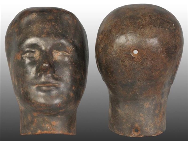 CAST IRON MANNEQUIN HEAD IN TWO PIECES.           