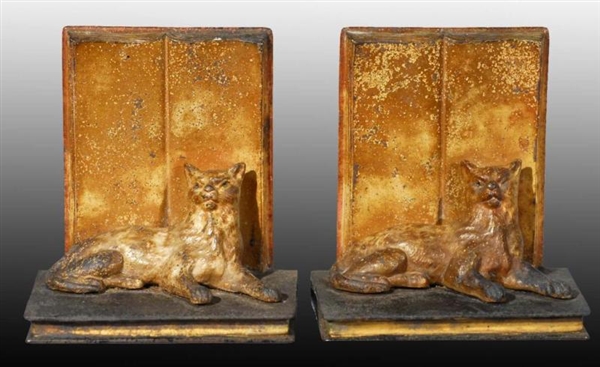 CAST IRON LYING DOWN CAT BOOKENDS.                