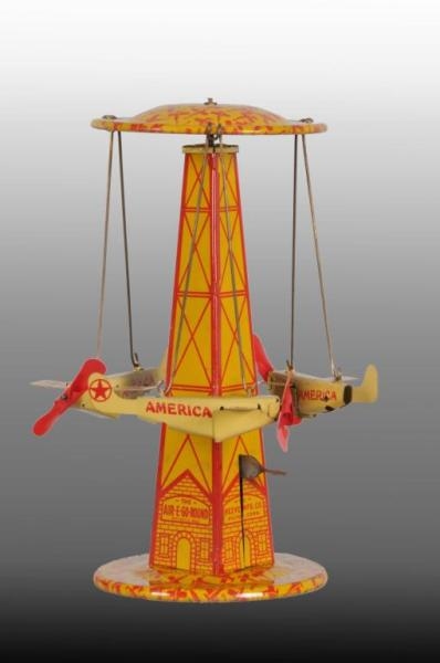 TIN REEVES AIR-E GO-ROUND WIND-UP TOY.            