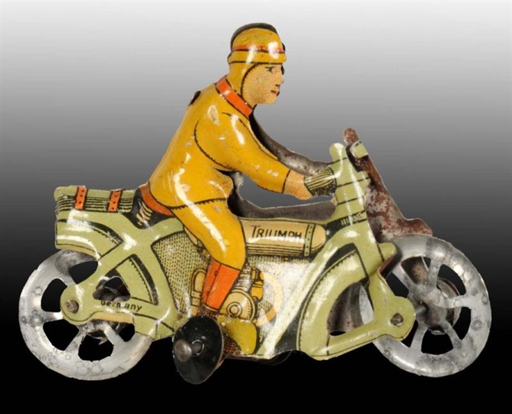 TIN MOTORCYCLE PENNY TOY.                         