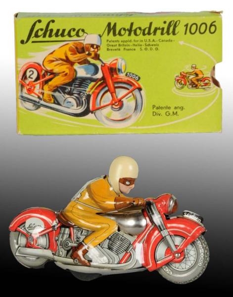 TIN SCHUCO MOTODRILL MOTORCYCLE WIND-UP TOY.      