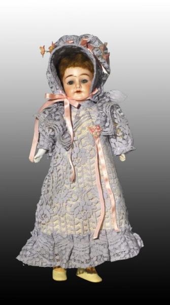 OPEN MOUTH DOLL IN BLUE LACE OUTFIT.              