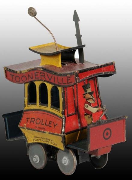 TIN NIFTY TOONERVILLE TROLLEY WIND-UP TOY.        