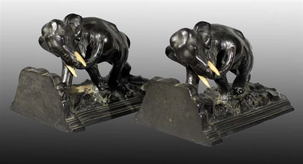 METAL CHARGING ELEPHANT BOOKENDS.                 
