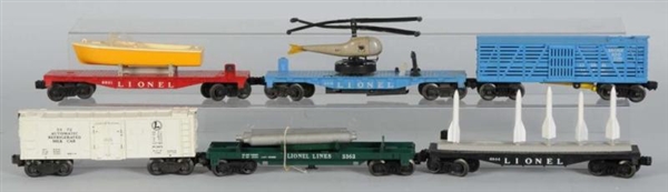 LOT OF 13: ASSORTED LIONEL FREIGHT CARS.          
