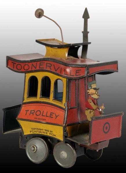 TIN NIFTY TOONERVILLE TROLLEY WIND-UP TOY.        