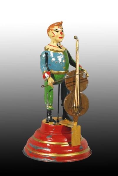 TIN HANDPAINTED CLOWN PLAYING CELLO WIND-UP TOY.  