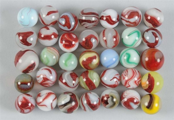 ASSORTMENT OF OXBLOOD MARBLES.                    