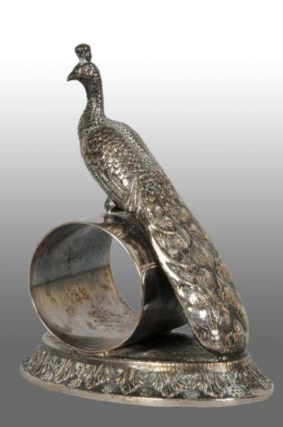 LARGE PEACOCK ON FIGURAL NAPKIN RING.             