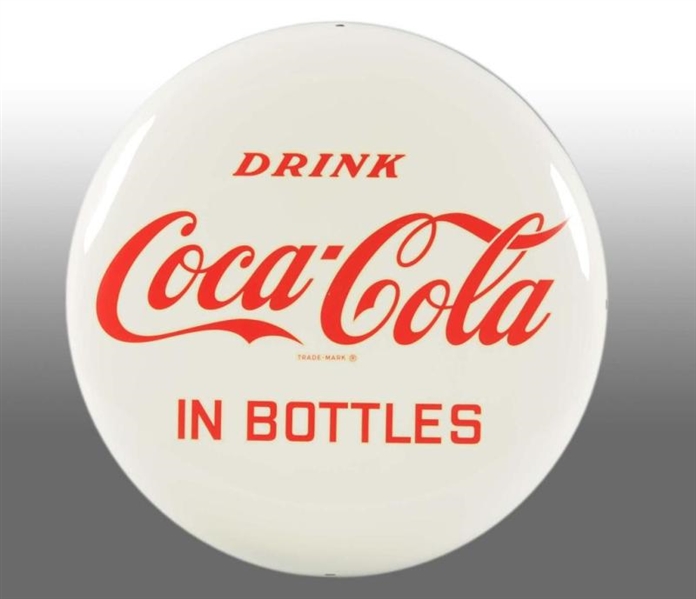 ALUMINUM COCA-COLA BUTTON WITH "IN BOTTLES" DECAL.