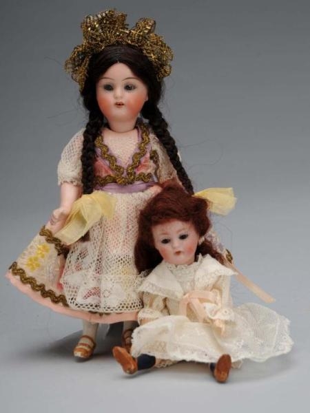 LOT OF 2: SMALL BISQUE-HEAD DOLLS.                