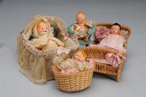 LOT OF 4: DOLL BABIES AND BEDS.                   