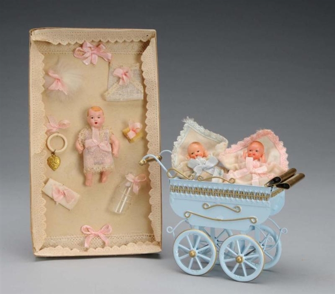 LOT OF DOLL BABIES AND CARRIAGE.                  