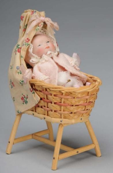 ALL-BISQUE BYE-LO BABY DOLL IN WICKER BASSINET.   