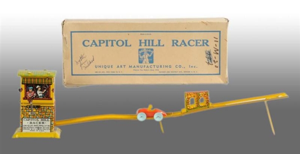 TIN UNIQUE ART CAPITAL HILL RACER WIND-UP TOY.    