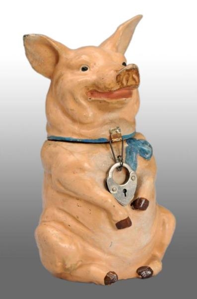 LEAD SEATED PIG STILL BANK.                       