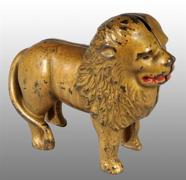 CAST IRON LION WITH TAIL RIGHT STILL BANK.        