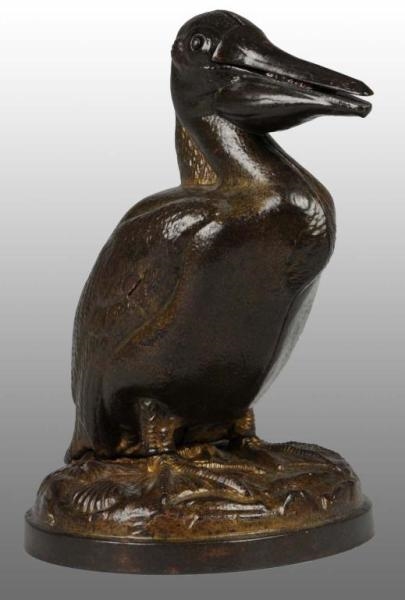 CAST IRON PELICAN WITH MAMMY MECHANICAL BANK.     