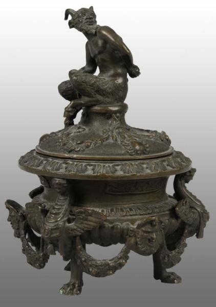 BRONZE TOBACCO URN WITH SEATED SATYR.             