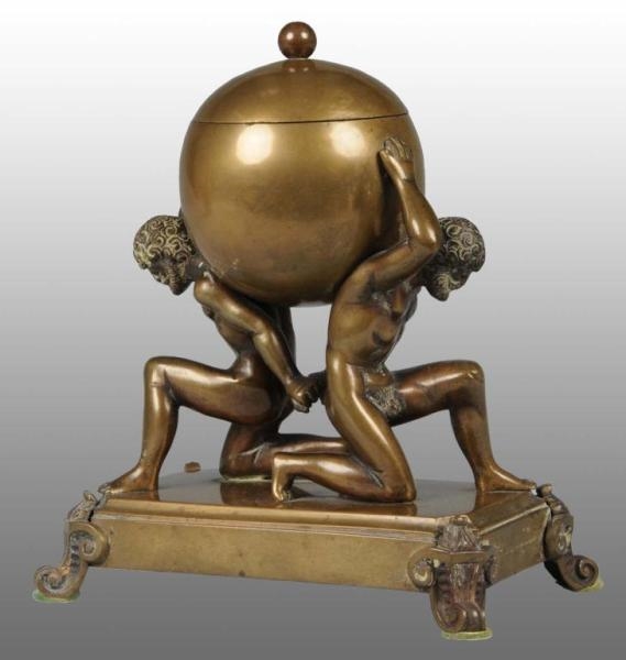 BRASS TOBACCO URN WITH 2 ATLAS-LIKE FIGURES.      