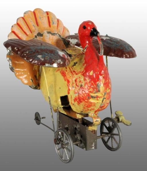 TIN HAND-PAINTED TURKEY WIND-UP TOY.              