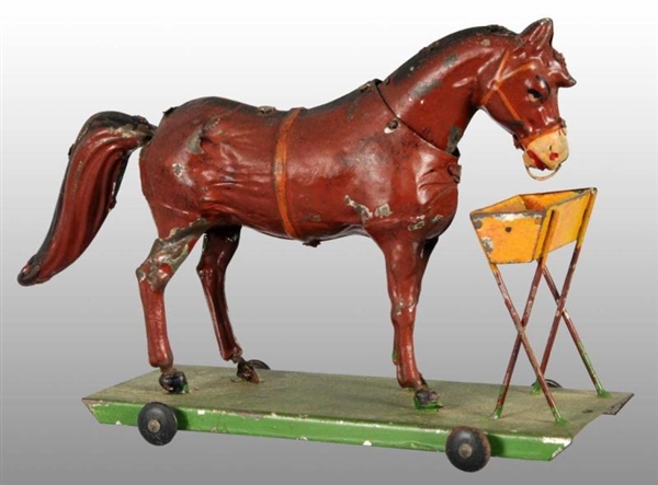 TIN HAND-PAINTED HORSE PLATFORM WIND-UP TOY.      