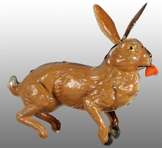 TIN HAND-PAINTED RABBIT WIND-UP TOY.              
