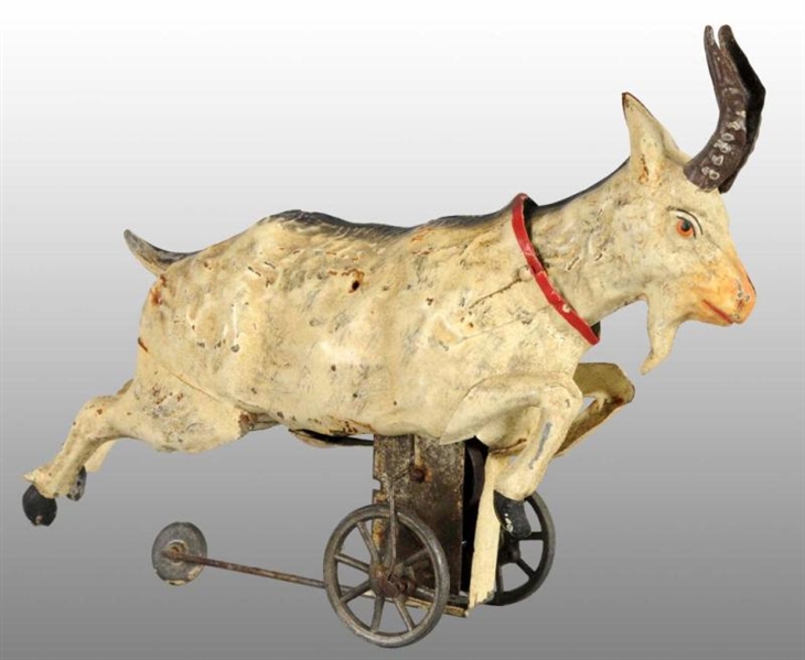 TIN HAND-PAINTED GOAT WIND-UP TOY.                