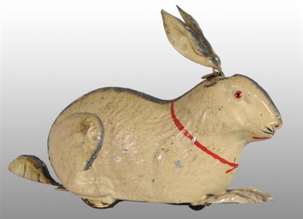 TIN HAND-PAINTED RABBIT WIND-UP TOY.              
