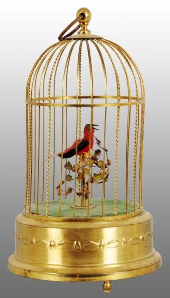 TIN BIRD IN CAGE MUSIC BOX WIND-UP TOY.           