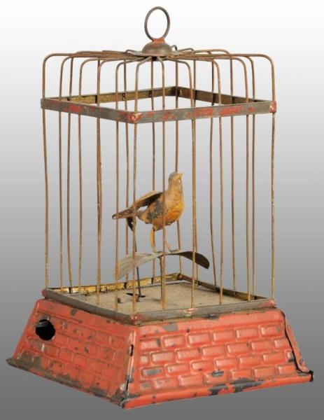TIN HAND-PAINTED BIRDCAGE WIND-UP TOY.            