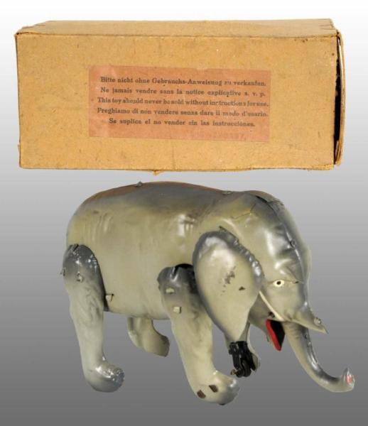 TIN HAND-PAINTED ELEPHANT WIND-UP TOY.            