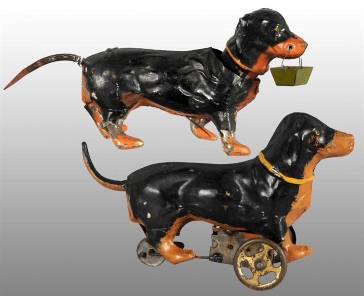 LOT OF 2: TIN HAND-PAINTED DACHSHUND WIND-UP TOYS.