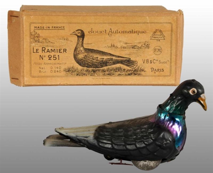 EARLY TIN PIGEON WIND-UP TOY.                     