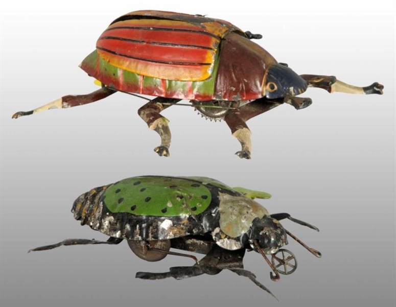 LOT OF 2: TIN HAND-PAINTED BEETLE WIND-UP TOYS.   