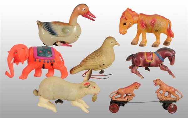 LOT OF 7: CELLULOID ANIMAL WIND-UP TOYS.          