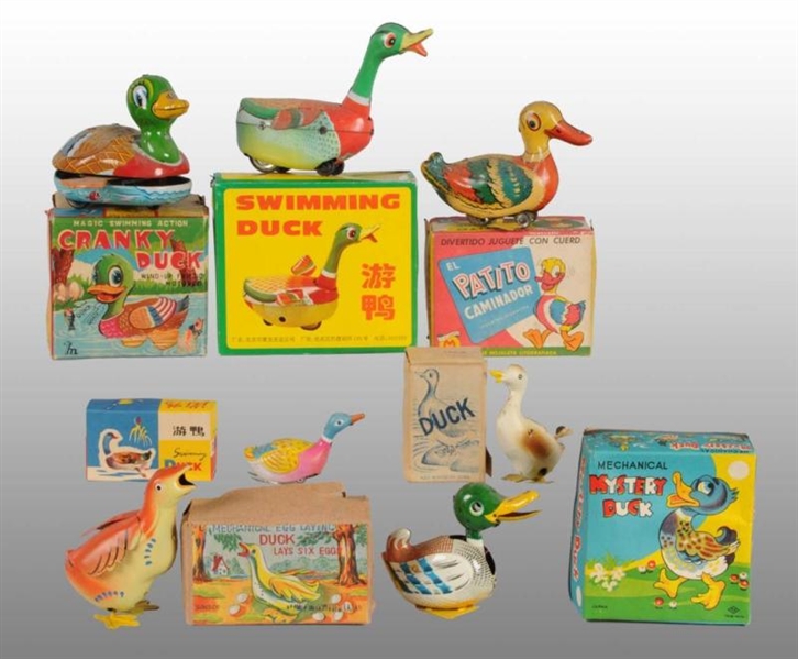 LOT OF 11: TIN DUCK TOYS.                         